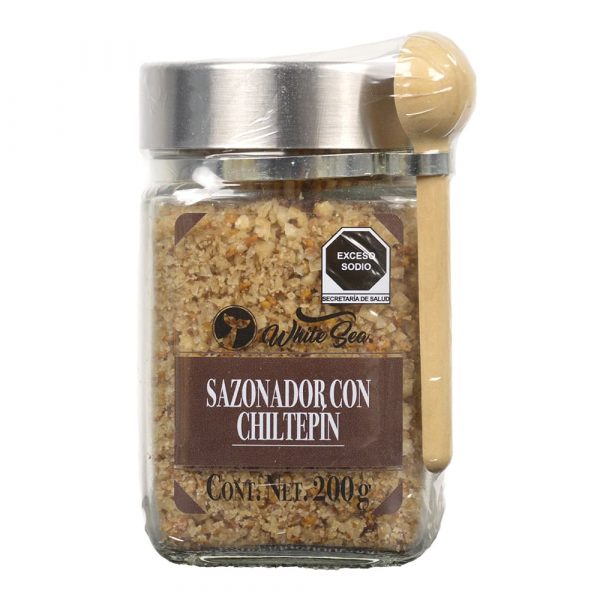 Sazonador con chiltepín White Sea en tarro de vidrio con cuchara de madera